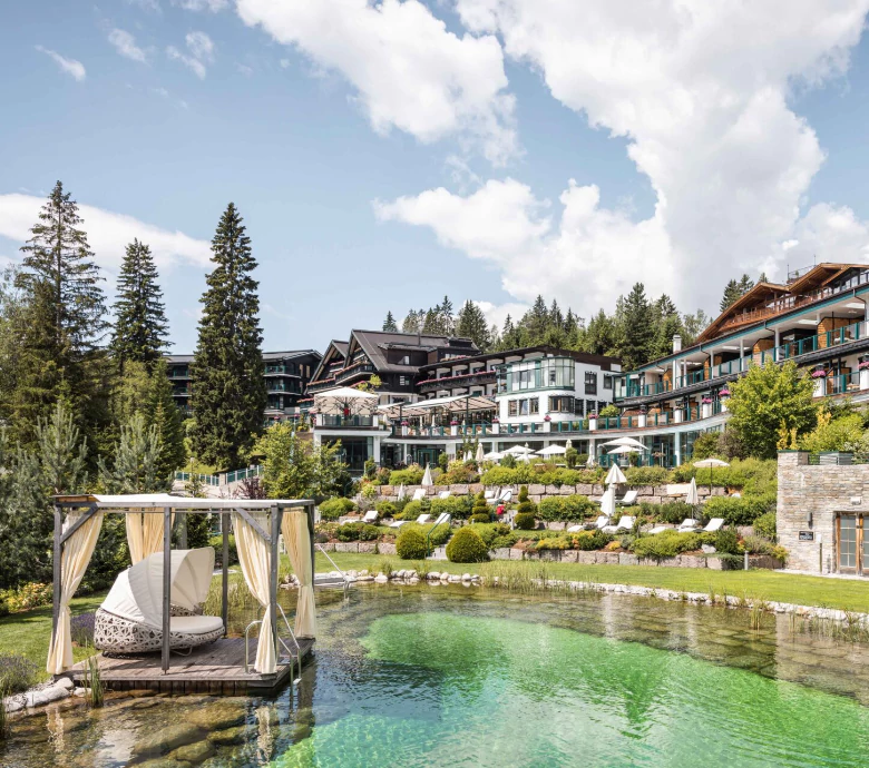 Front VIew of Alpin REsort Sacher, forest in the background a a nice lake in front