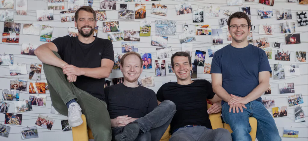 hotelkit’s founding team on a yellow couch